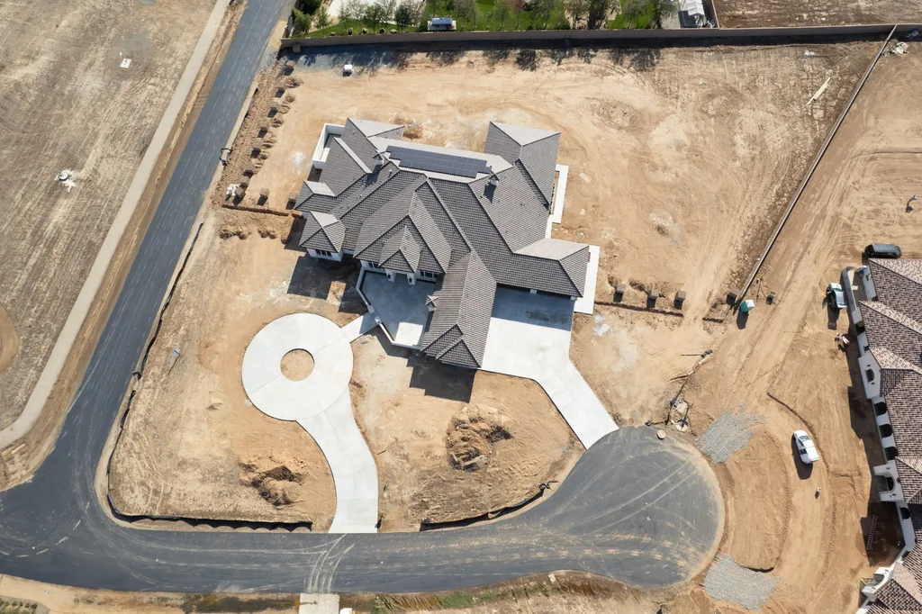 Aerial overhead view of the tile roofline and lot at Queens Estate in Clovis, California.