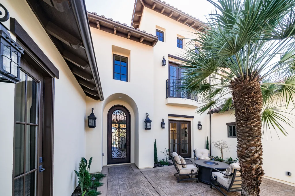 Private entry courtyard with palm and lounge seating at Spey Valley Estate I.